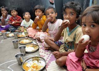 Children in anganwadis eating eggs.
